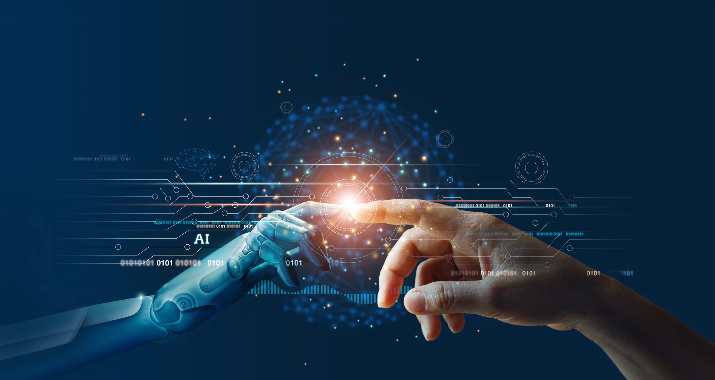 ALT Text: A robotic hand and a human hand touch fingertips, creating a glowing point of light, with AI-themed circuitry in the background.